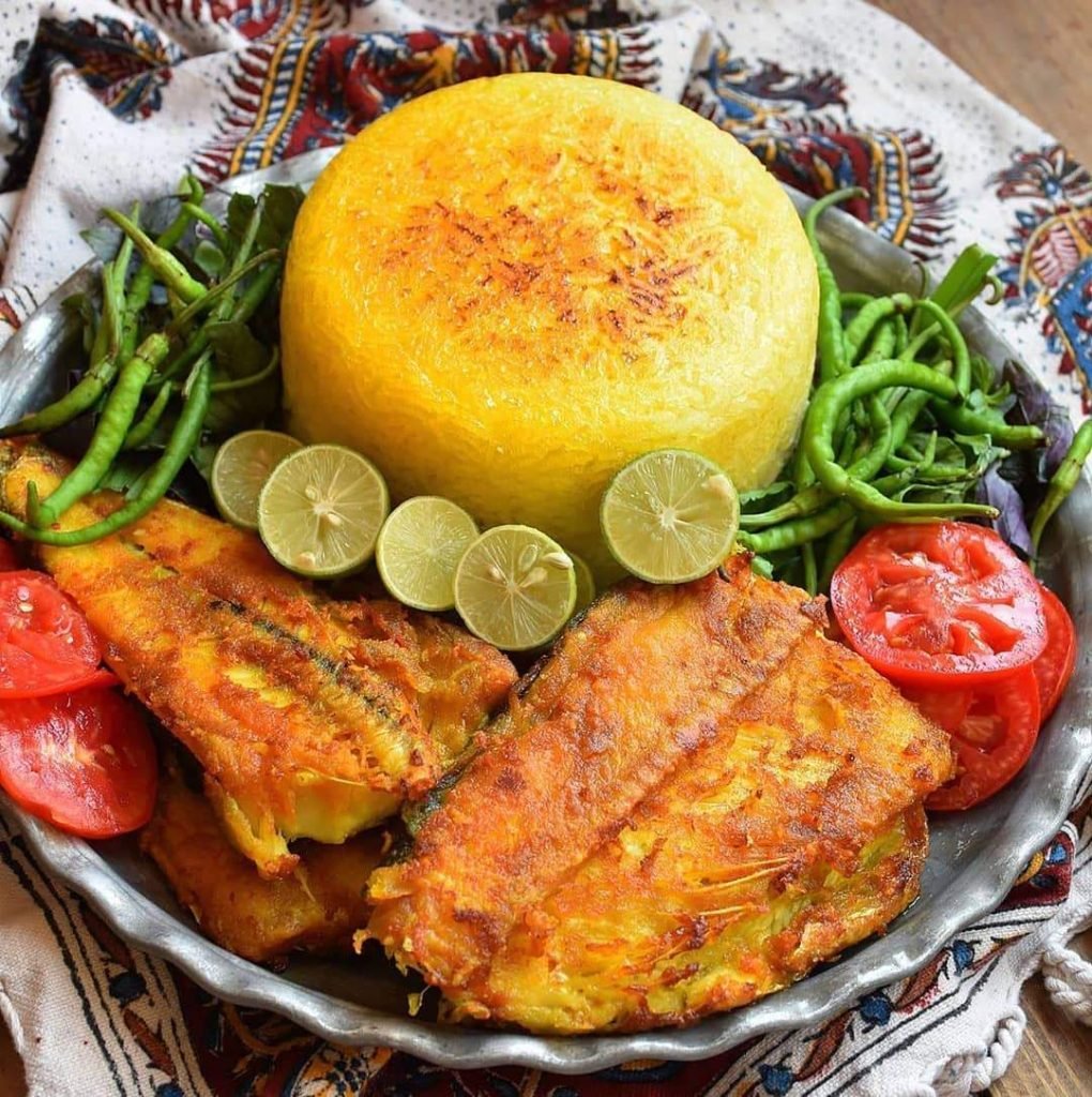 Tender fish fillet with saffron and colourful Mediterranean vegetables